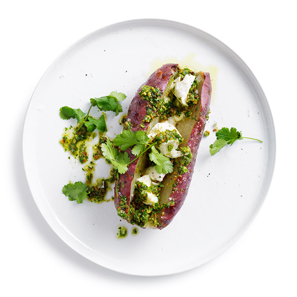 Delicious purple sweet potatoes split with coriander pesto.  Full of flavour this recipe works well as a side served with beef or lamb.